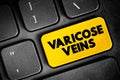 Varicose Veins - swollen and enlarged veins that usually occur on the legs and feet, text concept button on keyboard