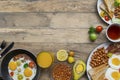 Varied breakfast meals on the wooden table Royalty Free Stock Photo
