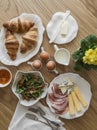 A varied breakfast served on a wooden table, top view Royalty Free Stock Photo