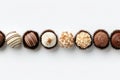Varied flavored chocolates array against clean background, offering ample space for branding