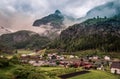 Varied landscape of the train tour with the waterfall in background.