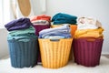 varied laundry baskets grouped by color clothing