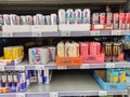 Varied range of energy drink cans with leading brands such as red bull, coca cola energy and lesser known brands punch, spring up
