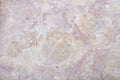 Variegated rough stone with grey, pink, and beige colors background Royalty Free Stock Photo