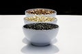Varieties of beans in bowls, white background Royalty Free Stock Photo