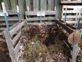 Varieties of compost piles or mounds with signs