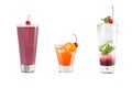 A variety of alcoholic drinks, beverages and cocktails on a white background. Three different drinks with maraschino cherries Royalty Free Stock Photo