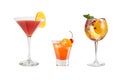 A variety of alcoholic drinks, beverages and cocktails on a white background. Three refreshing drinks in different glass goblets