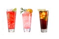 A variety of alcoholic drinks, beverages and cocktails on a white background. Three refreshing drinks in glass goblets