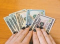 Variety of American money laid out under a stack of cash.Hundred US dollar bills. Selective focus. Royalty Free Stock Photo