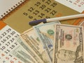 Variety of American money laid out under a stack of cash.Hundred US dollar bills. Selective focus. Royalty Free Stock Photo