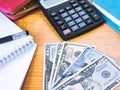 Variety of American money laid out under a stack of cash.Hundred US dollar bills. Selective focus. Royalty Free Stock Photo