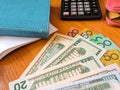 Variety of American money laid out under a stack of cash.Hundred US dollar bills. Selective focus. Royalty Free Stock Photo