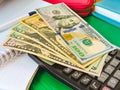 Variety of American money laid out under a stack of cash.Hundred US dollar bills. Selective focus. Royalty Free Stock Photo