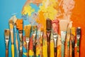 A variety of artist paint brushes laid out on a vibrant background, in art class extracurricular hobby at school or