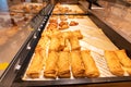 Variety of baked products at a supermarket. Display of a bakery there is a wide variety of baked goods to offer Royalty Free Stock Photo