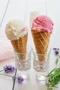 A variety of balls of ice cream in cones with chocolate, vanilla and strawberries Royalty Free Stock Photo