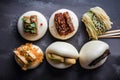 a variety of bao buns with different fillings, including savory and sweet