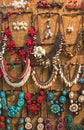 Variety of Beautiful Creative Shine Colorful Stone Plastic Jewellery Necklaces Hanging on The Wall for Sale in The Market