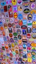 Variety of beer coasters adorn walls and ceiling in English pub