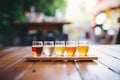 variety of beer flights on a wooden table