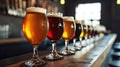 Assorted Beer Glasses Lined on Bar Counter Royalty Free Stock Photo