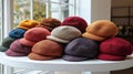 variety berets multiple colors and styles are neatly arranged white display stand Royalty Free Stock Photo