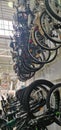 A variety of bikes hang in rows inside a modern bicycle store interior. Royalty Free Stock Photo