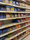 Variety of biscuits in good and interesting packaging and displayed on the racks inside the shop.