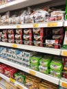 Variety of biscuits in good and interesting packaging and displayed on the racks inside the shop.