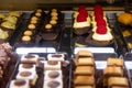 Variety of bite cakes with raspberry, chocolate and cookies