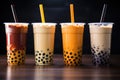Variety of boba bubble tea with straws on a wooden table Royalty Free Stock Photo