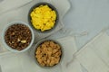 Variety of breakfast cereals and muesli in bowls on a light wooden background. Fast food. Top view. Space for text.