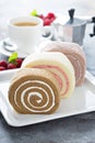 Variety of cake rolls with coffee