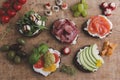 Variety of canape with salmon, prosciutto,avocado, mozzarella ,tomato,pesto,olives, cream cheese. Mix of different snacks and appe