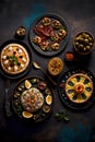 Variety of canapes on dark background. Top view, flat lay