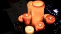 Group of burning candles on table with glowing surface