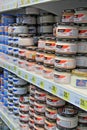 Variety of capelin caviar in glass jars selling on shelves of supermarket