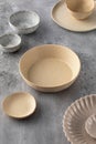 A variety of ceramic empty plates and bowls on the table. Kitchen, menu.