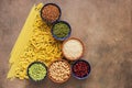 A variety of cereals, legumes and pasta in the form of an abstract Christmas tree. Top view, flat lay, copy space