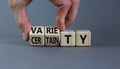 Variety or certainty symbol. Concept words Variety or certainty on wooden cubes. Businessman hand. Beautiful grey table grey