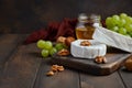 Variety of cheese with grapes, walnuts and honey. Royalty Free Stock Photo