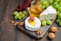 Variety of cheese with grapes, walnuts and honey. Royalty Free Stock Photo