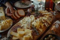 A Feast of Fromage Rustic Bread and Artisanal Cheese on a Wooden Table