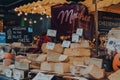 Variety of cheeses at the Palace of Cheese stand in Borough Market, London, UK