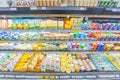 a variety of cheeses in the refrigerated display case In a large supermarket Royalty Free Stock Photo