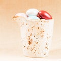 Variety of chocolate eggs in milk jar Royalty Free Stock Photo