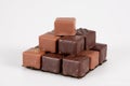 Variety chocolate pralines in pyramid view in white background