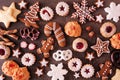 Variety of Christmas cookies and baked sweets, top view over a dark stone background Royalty Free Stock Photo