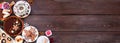 Variety of Christmas holiday desserts and sweets. Above view corner border over a wood banner background. Royalty Free Stock Photo